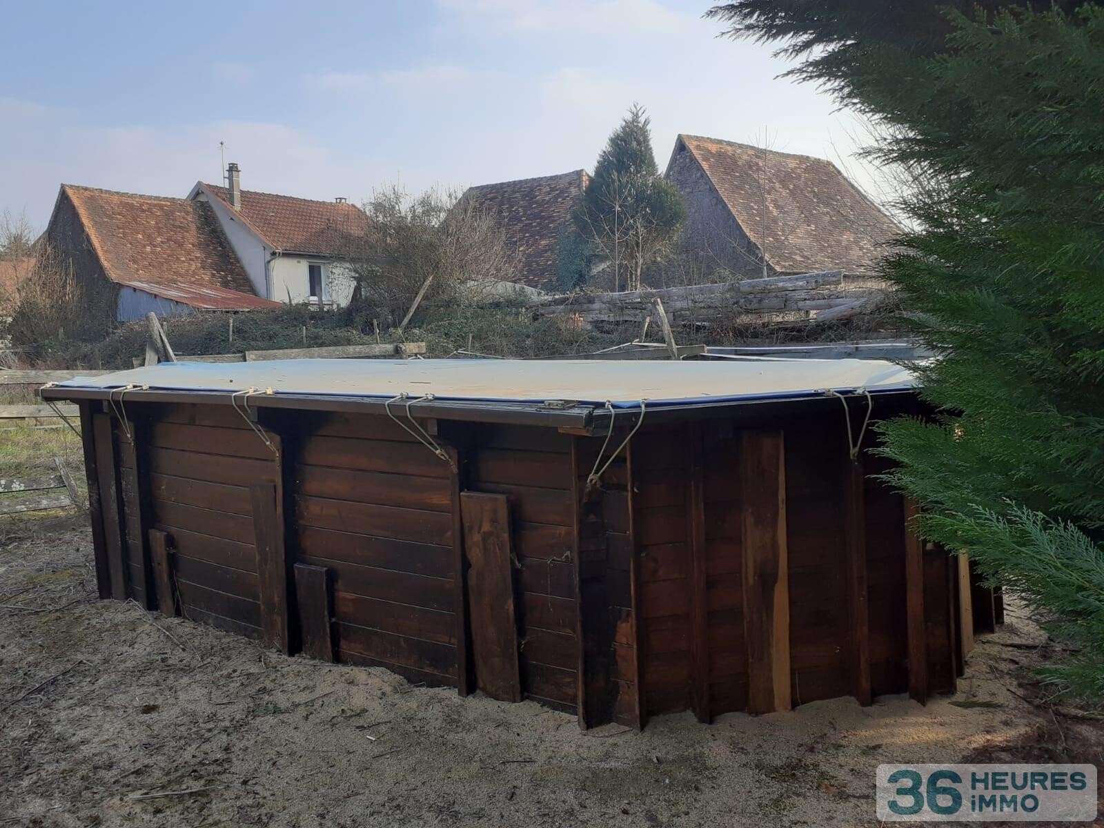 Ensemble immobilier - maison + grange + dépendances sur vaste terrain