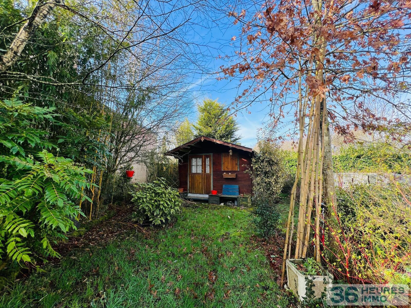 Logement type 2 sur jardin arboré