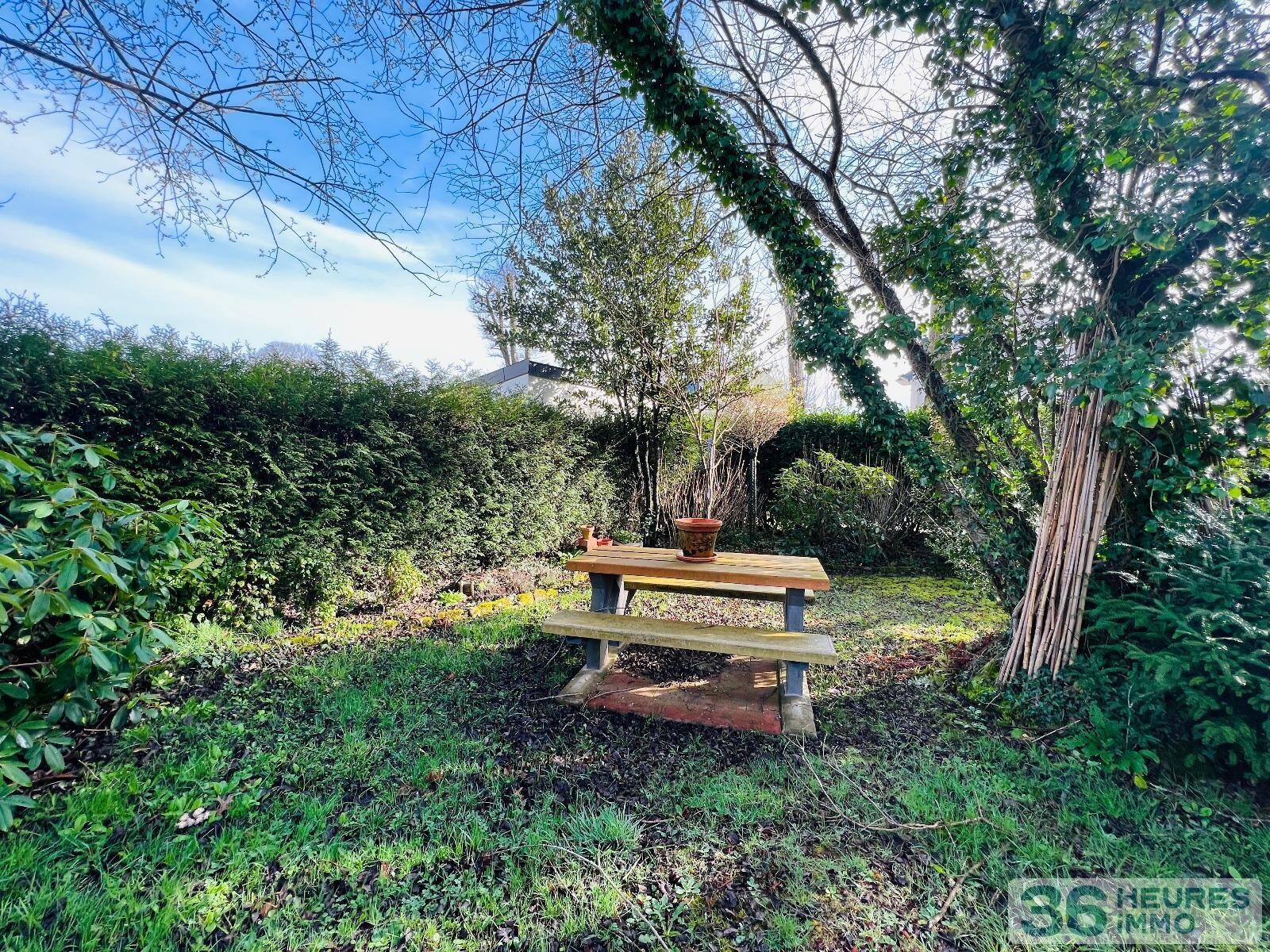 Logement type 2 sur jardin arboré