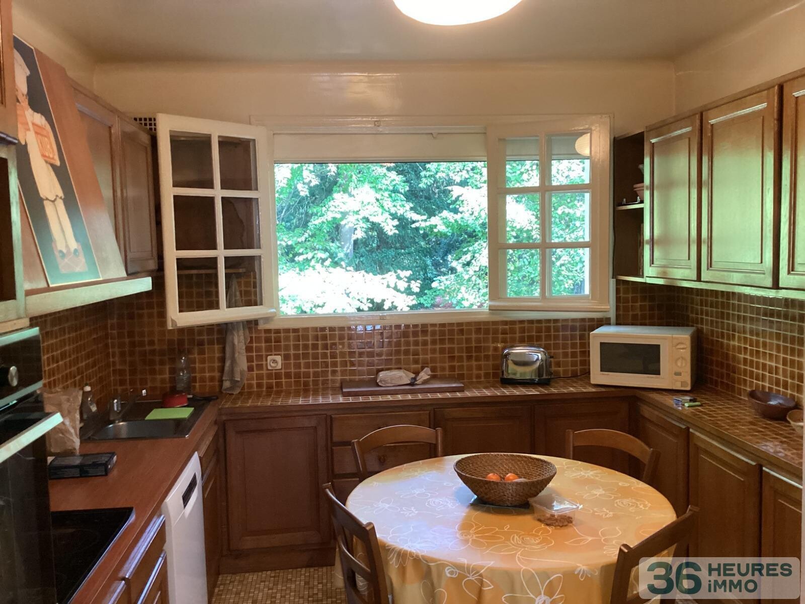 Pavillon style ile de france sur sous-sol avec partie de terrain constructible