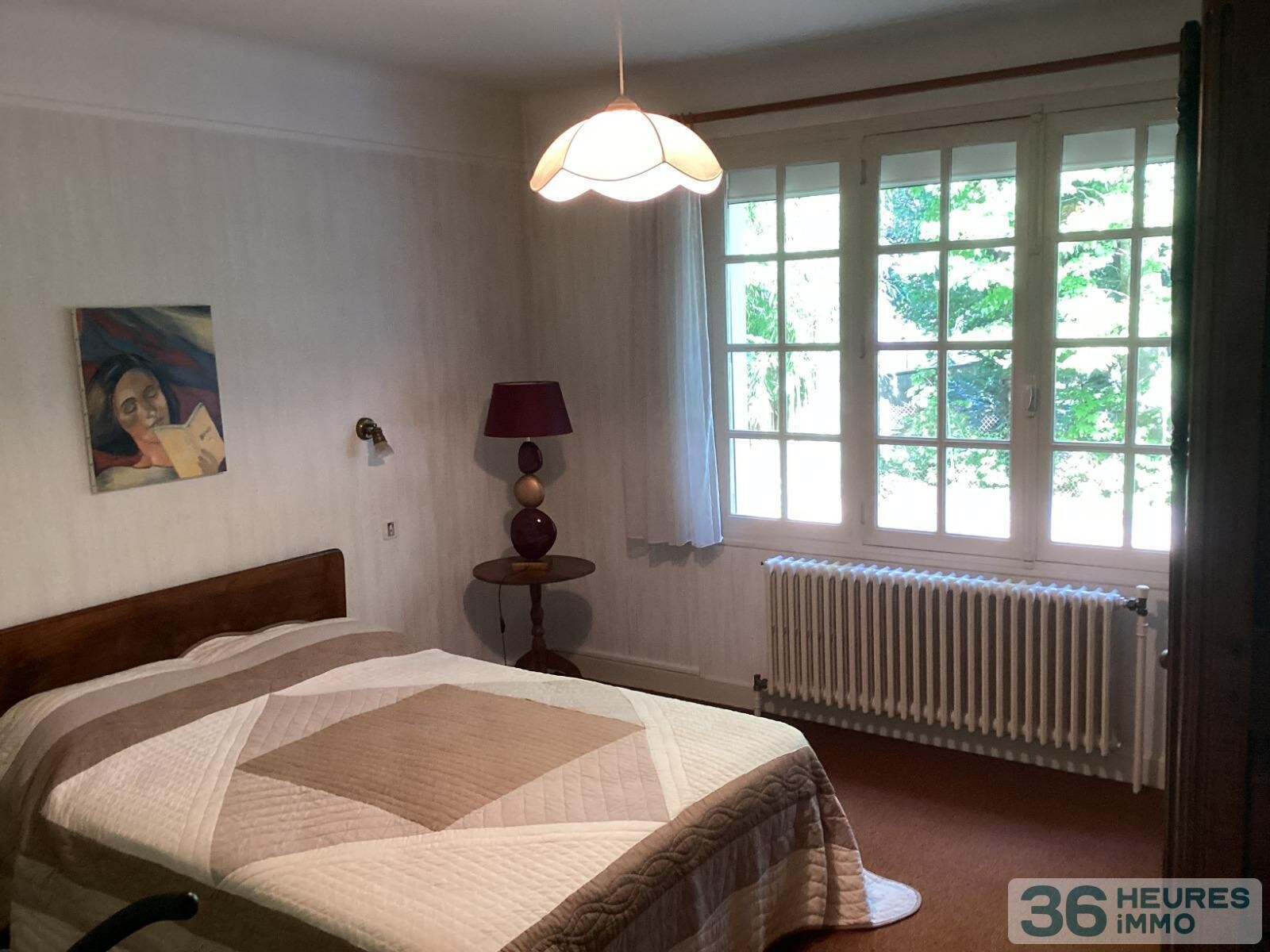 Pavillon style ile de france sur sous-sol avec partie de terrain constructible