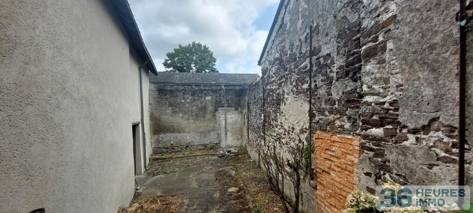 VENTE MAISON DE BOURG AVEC GRAND GARAGE ET COUR 