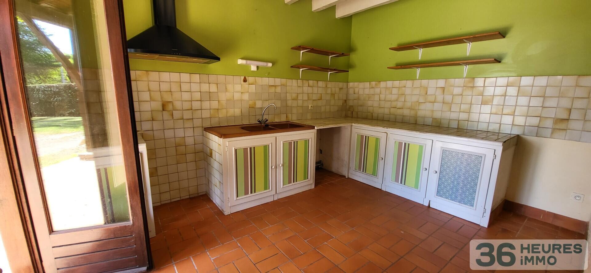 Maison année 80 avec jardin et garage 