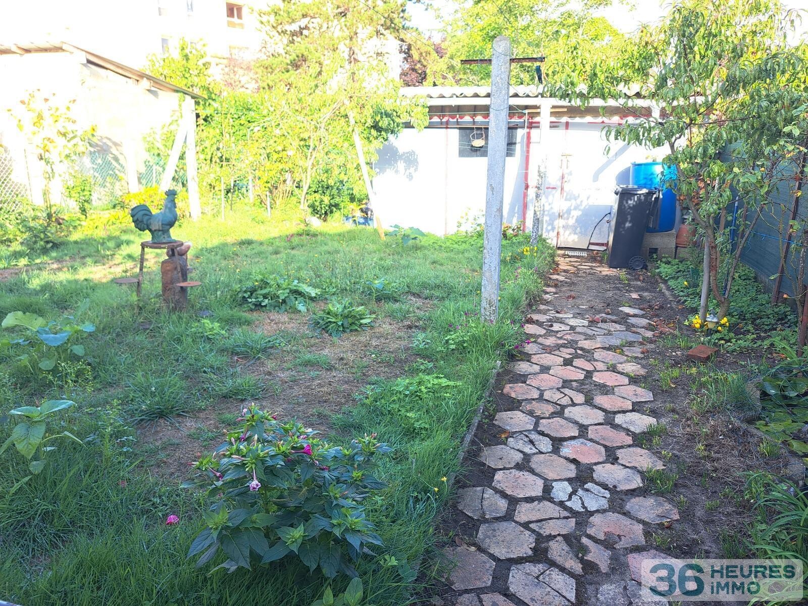 PLAIN PIED AVEC GARAGE ET JARDIN 