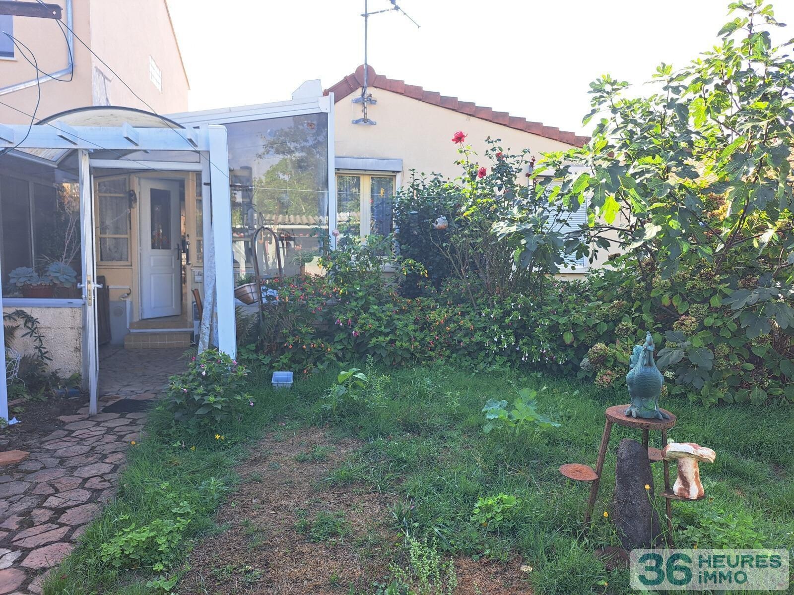 PLAIN PIED AVEC GARAGE ET JARDIN 