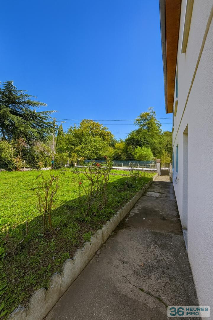 Maison avec jardin et sous-sol complet non enterré, à deux pas des commodités