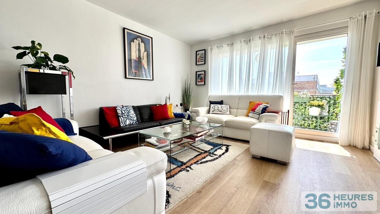 Appartement rénové de 95 m² avec balcon, parc privé et parking en sous-sol